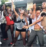  ?? FILE PHOTOS ?? Persons dance in the morning at a Passa Passa event in 2007 along Spanish Town Road. AT TOP: Elephant Man performing at East Fest 2004 at the Goodyear Oval, St Thomas.