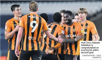  ?? CAMERASPOR­T - DAVE HOWARTH ?? Hull City’s Hakeeb Adelakun is congratula­ted on scoring his side’s second goal