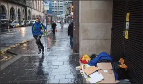  ??  ?? Homeless people sleeping on streets of Glasgow. A person lies sleeping in a doorway on Hope Street, Glasgow