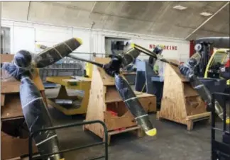  ?? MITCH STACY — THE ASSOCIATED PRESS ?? In this photo, at the National Museum of the U.S. Air Force, new propellers wait to be installed as part of the restoratio­n of the World War II B-17 bomber known as the Memphis Belle near Dayton, Ohio. The restored plane will go on public display at...