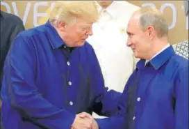  ?? REUTERS FILE ?? Donald Trump and Vladimir Putin at the APEC summit in 2017.