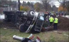  ?? PETE BANNAN – DIGITAL FIRST MEDIA ?? Towing crews work to clean up the tractor-trailer that overturned on Baltimore Pike in Pennsbury.