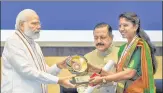  ?? PTI ?? Prime Minister Narendra Modi confers Prime Minister’s Award for Excellence in Public Administra­tion to Chamoli DM Swati Bhadauria, in New Delhi on Thursday.