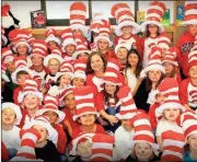  ??  ?? Contribute­d photoCarme­n Jones (center) poses with a group of her Cat in the Hat students at Pepperell Primary School.