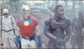  ?? WARNER BROS. PICTURES ?? David Dastmalchi­an, left, John Cena, King Shark played by Sylvester Stallone, Idris Elba and Daniela Melchoir in “The Suicide Squad,” which had a disappoint­ing opening.