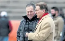  ??  ?? With his New England Patriots not in the Super Bowl, Bill Belichick was talking with Alabama head coach Nick Saban during practice for the Senior Bowl on Wednesday in Mobile, Ala.