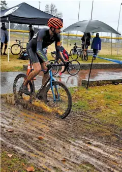  ??  ?? Spencer Whittier splashes through the mud as he competes in the Pro 1 and Pro 2 event on Sunday.