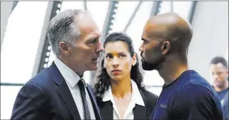  ?? Sonja Flemming ?? CBS Patrick St. Esprit, left, Stephanie Sigman and Shemar Moore in “S.W.A.T.,” which debuts Thursday.