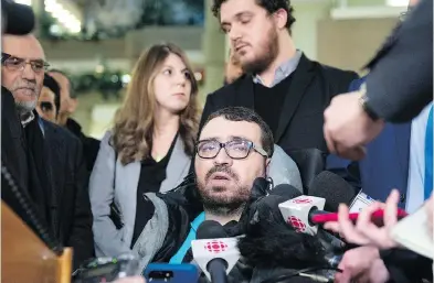  ?? JACQUES BOISSINOT / THE CANADIAN PRESS ?? Aymen Derbali, who was severely injured in the 2017 mass shooting at a Quebec City mosque, reacts to the judge’s sentencing of shooter Alexandre Bissonnett­e at a Quebec City courthouse on Friday.