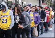  ??  ?? Fans line up to get into the Staples Center to attend a public memorial for former Los Angeles Lakers star Kobe Bryant and his daughter in Los Angeles.