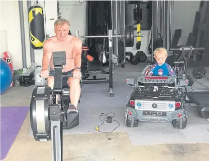  ??  ?? John Davidson training for the feat, alongside his son Lochlann.