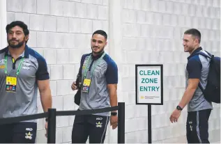  ??  ?? Jason Taumalolo, Valentine Holmes and Tom Opacic enter the stadium.