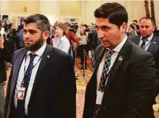  ?? AFP ?? Chief opposition negotiator Mohammad Alloush and a member of the rebel delegation Osama Abu Zeid leave following the Syria peace talks in Astana on Thursday.