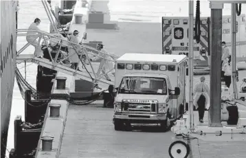  ?? MIKE STOCKER/SOUTH FLORIDA SUN SENTINEL ?? A passenger is evacuated from the Holland America ship the Zaandam at Port Everglades in Fort Lauderdale on April 2, 2020. Stranded cruise ship passengers became some of the first carriers of COVID-19.