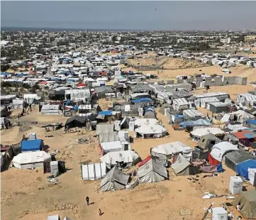  ?? ?? CRISIS: A camp for internally displaced Palestinia­ns in Rafah, southern Gaza Strip.