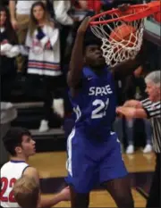  ?? RANDY MEYERS — THE MORNING JOURNAL ?? SPIRE Institute’s Isaiah Jackson dunks during a game against Bay at the Vermilion Tip Off Classic Nov. 30.