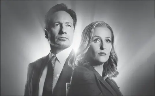  ??  ?? David Duchovny and Gillian Anderson star in “The X-Files.”