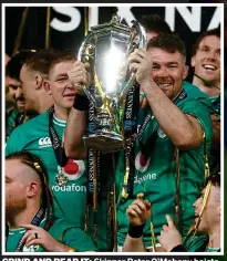  ?? ?? GRIND AND BEAR IT: Skipper Peter O’Mahony hoists the Six Nations trophy after gritty encounter