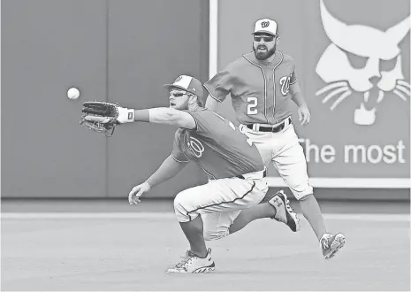  ?? JASEN VINLOVE, USA TODAY SPORTS ?? Nationals right fielder Bryce Harper, making a catch in Tuesday’s spring training game, was the National League MVP in 2015.