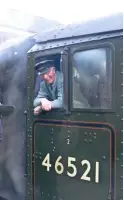  ?? MATTHEW COLLIER ?? former Penmaenpoo­l driver terry Lloyd on the footplate of Ivatt ‘2Mt’ 2‑6‑0 no. 46521 at Llangollen station on the evening of October 14.