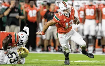  ?? ALLEN EYESTONE / THE PALM BEACH POST ?? Miami’s Malik Rosier (12) ranks seventh among ACC quarterbac­ks in rushing yards per carry (3.77). Before Rosier, the last UM quarterbac­k with 100 rushing attempts (sacks included) was Kary Baker in 1974.