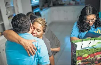  ?? Marie D. De Jesús / Houston Chronicle ?? Celia Rodriguez embraces her husband, Juan, for what may be his last Father’s Day in the U.S.