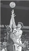  ?? COURTESY GCU ATHLETICS ?? Grand Canyon forward Gabe
McGlothan drives for a shot in an
82-77 win over UT Arlington in the first round of the WAC Tournament in Las Vegas.