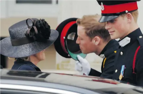  ?? ANWAR HUSSEIN/Getty Images ?? No one has rewritten the fairy tale about the cruel stepmother who seduces Daddy and tortures his offspring better than Camilla, Duchess of Cornwall,
left, seen in this 2006 photo receiving a kiss from stepson Prince William, centre, with Prince Harry...