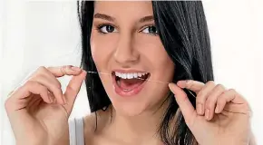  ?? 123RF ?? Commit two minutes of your day to floss your teeth to avoid cavities.