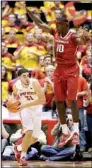  ?? AP/CHARLIE NEIBERGALL ?? Iowa State forward Georges Niang (left) gets Arkansas forward Bobby Portis to leave his feet during the first half of Thursday’s game in Ames, Iowa.