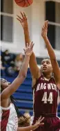  ?? Cody Bahn / Staff photograph­er ?? Magnolia West’s Kamryn Jones (44) shoots over Tomball’s Christina Thomas. Jones had a game-high 20 points.