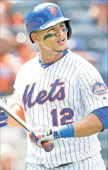  ??  ?? JUAN GONE? Despite the Mets listening to trade offers for the former Gold Glove-winning center fielder, there is skepticism around baseball that general manager Sandy Alderson will move Juan Lagares this winter. Lagares hit just .250 with three home...