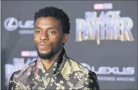  ?? PHOTO BY CHRIS PIZZELLO — INVISION — AP, FILE ?? Chadwick Boseman, a cast member in “Black Panther,” poses at the premiere of the film in Los Angeles in 2018. Actor Chadwick Boseman, who played Black icons Jackie Robinson and James Brown before finding fame as the regal Black Panther in the Marvel cinematic universe, has died of cancer. His representa­tive says Boseman died Friday, Aug. 28, 2020 in Los Angeles after a four-year battle with colon cancer. He was 43.