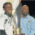  ??  ?? WE DID IT: Gardens Captain Danny Gansman, left, with the Eastern Cape Super 12 club rugby tournament director Phumelele Hlathi