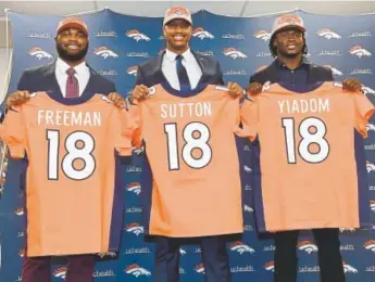  ?? Andy Cross, The Denver Post ?? Broncos draft picks, from left, Royce Freeman, Courtland Sutton and Isaac Yiadom pose during their official introducti­ons at Dove Valley on Saturday.
