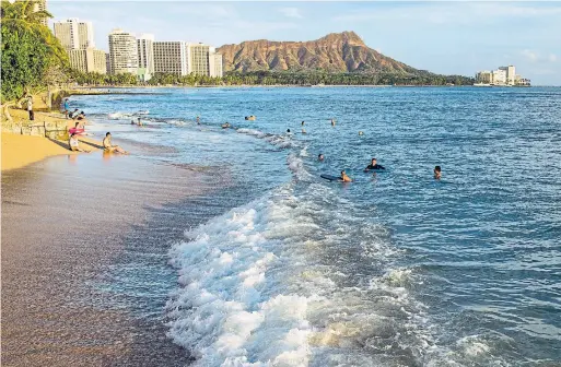  ?? MARCO GARCIA THE NEW YORK TIMES FILE PHOTO ?? Waikiki beach is seen in Honolulu, Hawaii, in September 2014. Visitors have been spotted on beaches breaking stay-at-home orders and quarantine restrictio­ns.