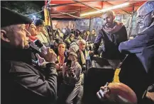  ?? AFP ?? People gather at a tent where Lebanese anti-government protesters debate and discuss political and economic topics at Al Nour Square in Tripoli last Wednesday.