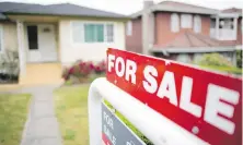  ?? JONATHAN HAYWARD, THE CANADIAN PRESS ?? The chief economist of the British Columbia Real Estate Associatio­n says an incoming tax on flipping houses will have minimal effect on affordabil­ity.