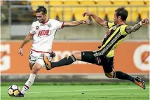  ?? PHOTO: GETTY IMAGES ?? Wellington Phoenix defender Tom Doyle makes a diving challenge against Adelaide United this season.