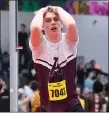  ?? PHOTO BY JIM MAHONEY — MEDIANEWS GROUP/BOSTON HERALD ?? Arlington’s Rowan McConkey reacts in disbelief after clearing 6’ 6” only to have the bar topple a moment later.