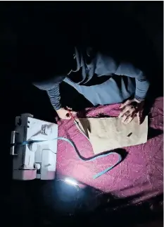  ?? | Supplied ?? SAHIMA Mahomed cuts material during load shedding.