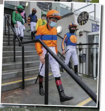  ?? RIGHT: Photo By Domnick Walsh. ?? Jockeys heading to the paddock at Killarney on Tuesday evening wearing the now-mandatory face mask.