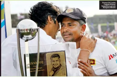  ??  ?? Former Sri Lanka Captain Kumar Sangakkara greets Rangana Herath