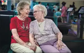  ?? Allen J. Schaben Los Angeles Times ?? LILLIAN SOLOMON, left, and Elaine Allen bowl together in a seniors league in Torrance. “She’s an inspiratio­n ... to me,” a fellow bowler says of Solomon.