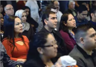  ?? DAVID ROYAL — MONTEREY HERALD ?? Ahmad Wahed, formerly of Afghanista­n, listens with others before being sworn in during a U.S. citizenshi­p ceremony at Cesar Chavez Library in Salinas in 2016.