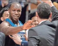  ?? Carlos Gonzalez/Minneapoli­s Star Tribune/TNS) ?? Gorgui Dieng of the Minnesota Timberwolv­es celebrates after making a three point shot late in the fourth quarter against the Brooklyn Nets Monday, Dec. 30, 2019 at the Target Center in Minneapoli­s, Minn. The Timberwolv­es won, 122-115.