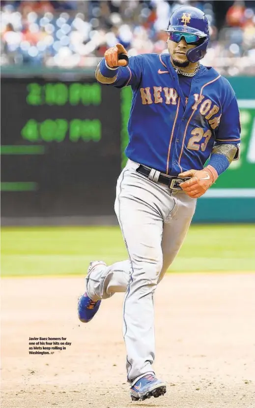  ?? AP ?? Javier Baez homers for one of his four hits on day as Mets keep rolling in Washington.