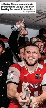  ?? Phil Mingo/PPAUK ?? Exeter City players celebrate promotion to League One after beating Barrow at St James Park