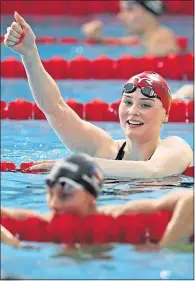  ??  ?? Freya Anderson celebrates 200m freestyle success in Glasgow last night