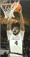  ?? Photo by Louriann Mardo-Zayat / lmzartwork­s.com ?? Maliek White goes up for two of his career-high 18 points during Providence’s win over Central Connecticu­t on Sunday. For one game, White’s performanc­e helped Friar fans forget that star freshman A.J. Reeves will be out with a foot injury for at least the next month. PC plays its final non-conference home game tonight (7 p.m.) against Albany.